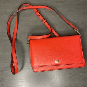Michael Kors Red Orange cross body wallet purse with phone case.